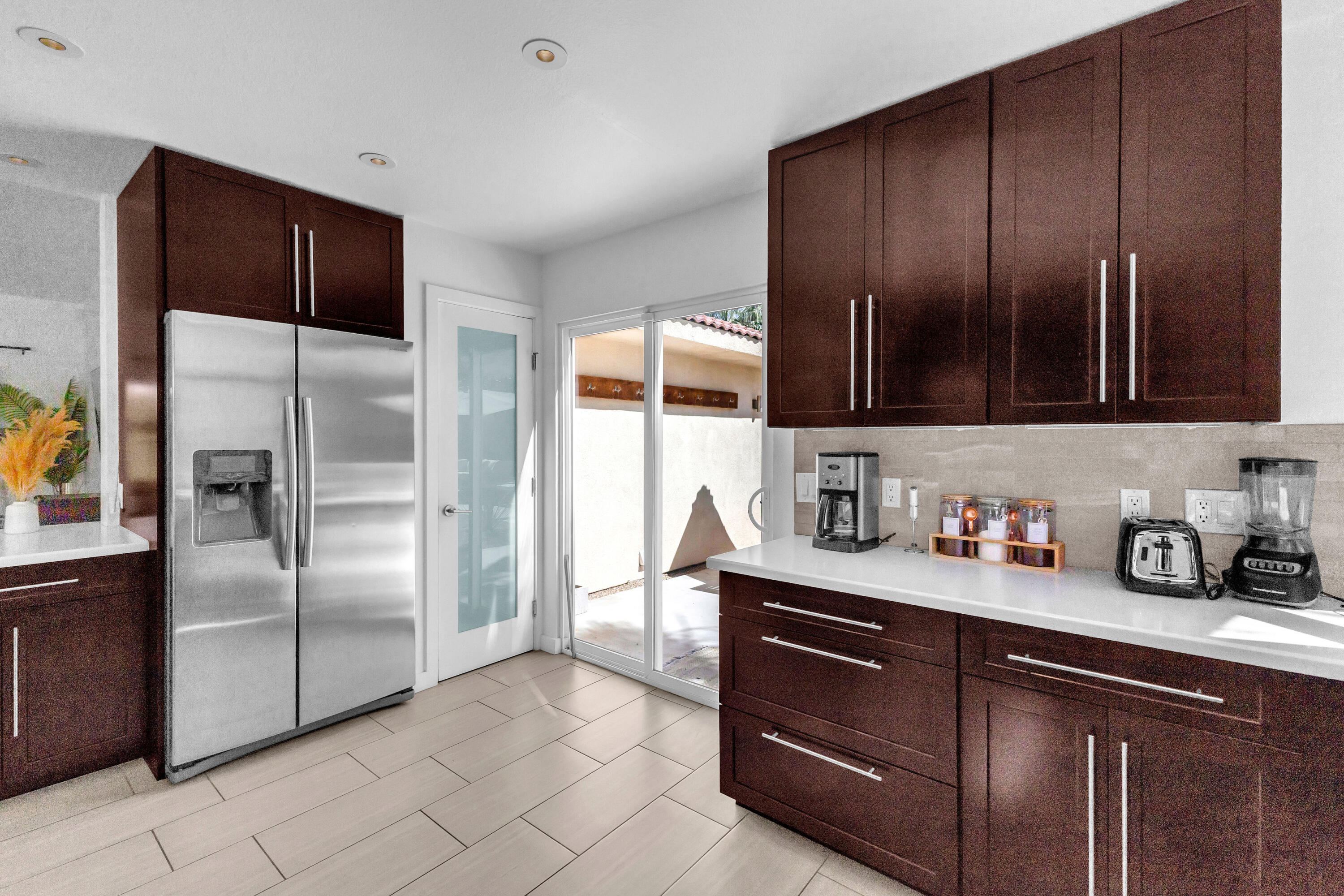 2355 West Nicola Road Palm Springs, CA 92262 - Photo 39 of 54 a kitchen with stainless steel appliances granite countertop a refrigerator and a sink