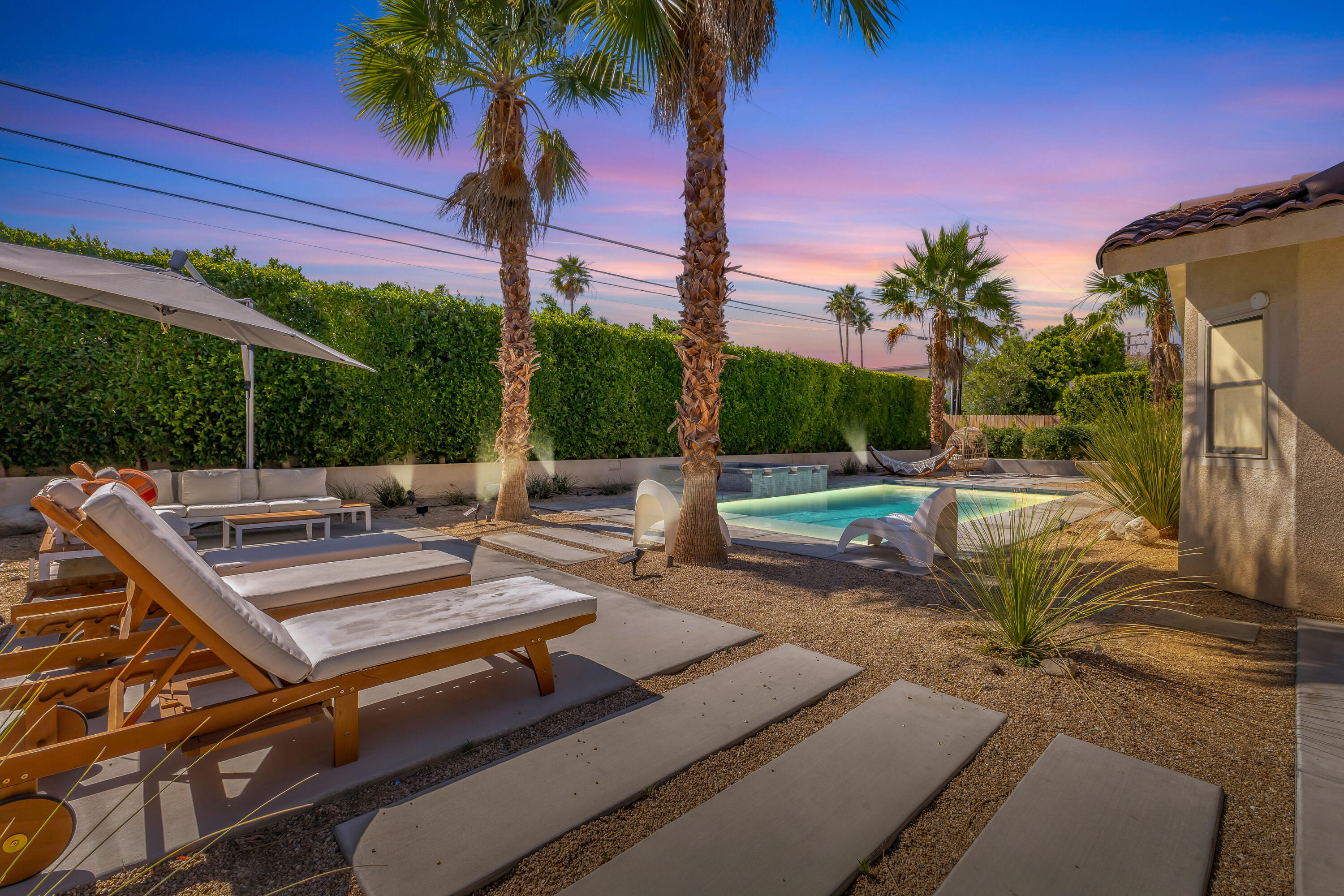 2355 West Nicola Road Palm Springs, CA 92262 - Photo 5 of 54 a view of a patio with swimming pool