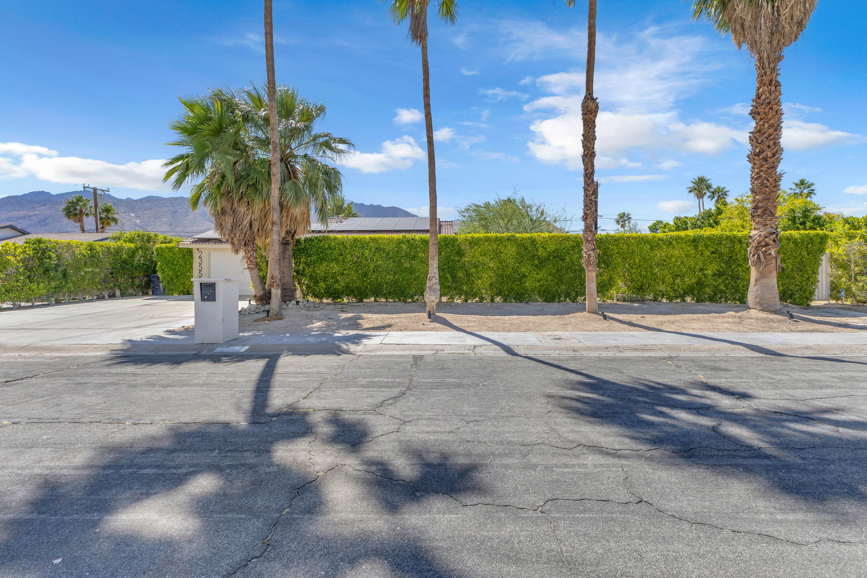2355 West Nicola Road Palm Springs, CA 92262 - Photo 9 of 54 a view of a street with a road sign