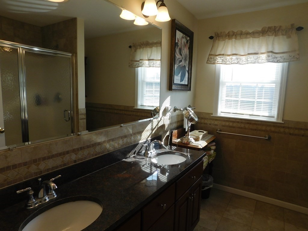 16 Pierce Road Sutton, MA 01590 - Photo 12 of 42 a bathroom with a sink vanity granite and a mirror