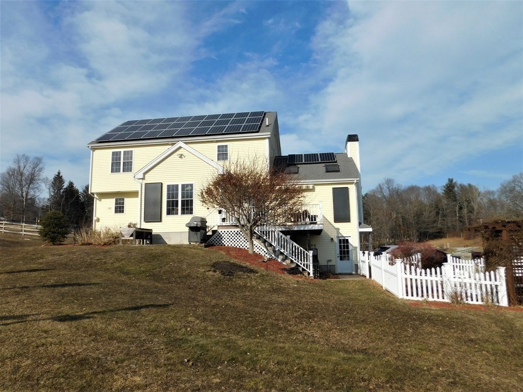 16 Pierce Road Sutton, MA 01590 - Photo 16 of 42 a view of a house with a patio