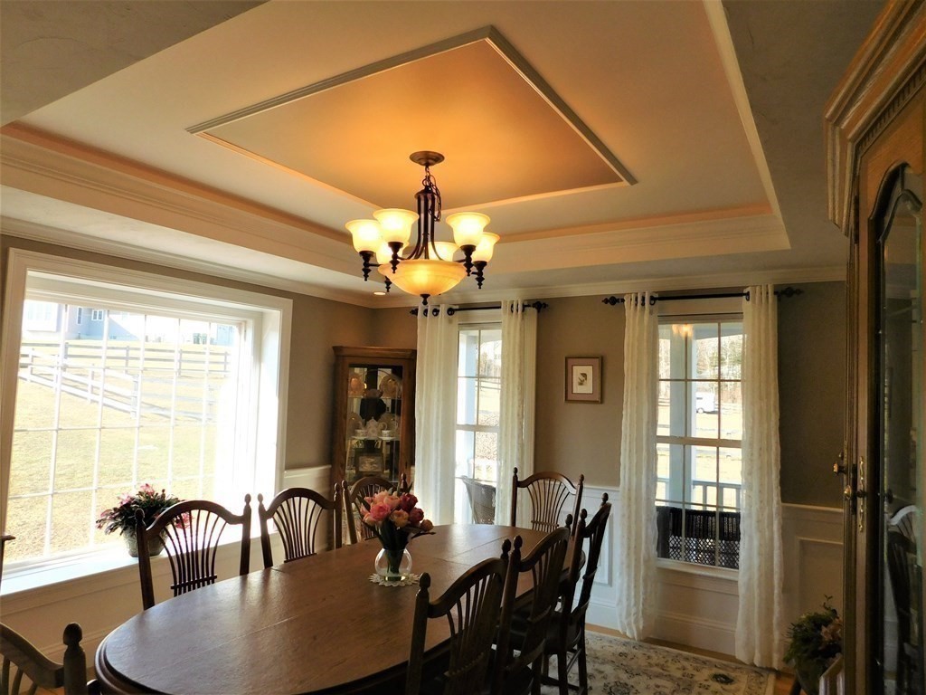 16 Pierce Road Sutton, MA 01590 - Photo 5 of 42 a view of a dining room with furniture window and wooden floor
