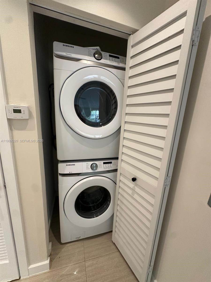 9464 Abbott Avenue Surfside, FL 33154 - Photo 13 of 37 a utility room with dryer and washer