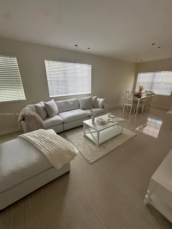 a living room with couches and a table