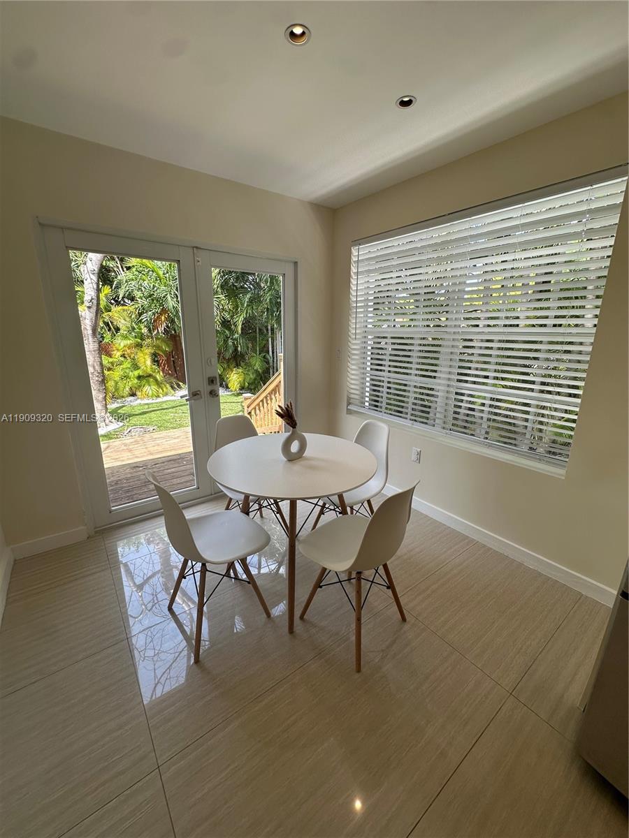 9464 Abbott Avenue Surfside, FL 33154 - Photo 26 of 37 a view of a dining room with furniture window and outside view