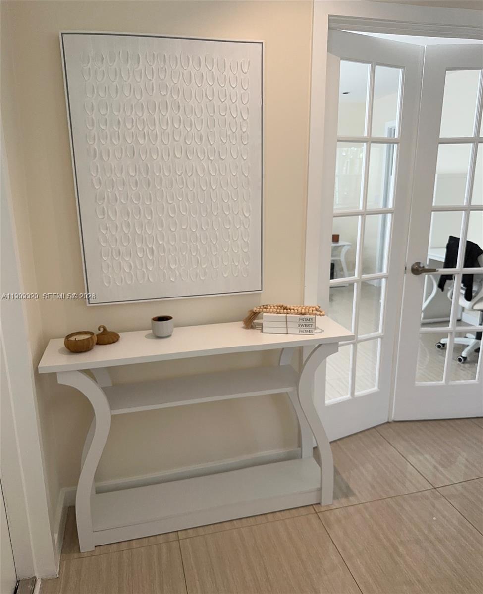 9464 Abbott Avenue Surfside, FL 33154 - Photo 34 of 37 a bathroom with a sink and a mirror