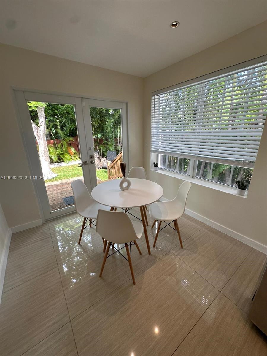 9464 Abbott Avenue Surfside, FL 33154 - Photo 7 of 37 a view of a dining room with furniture window and outside view