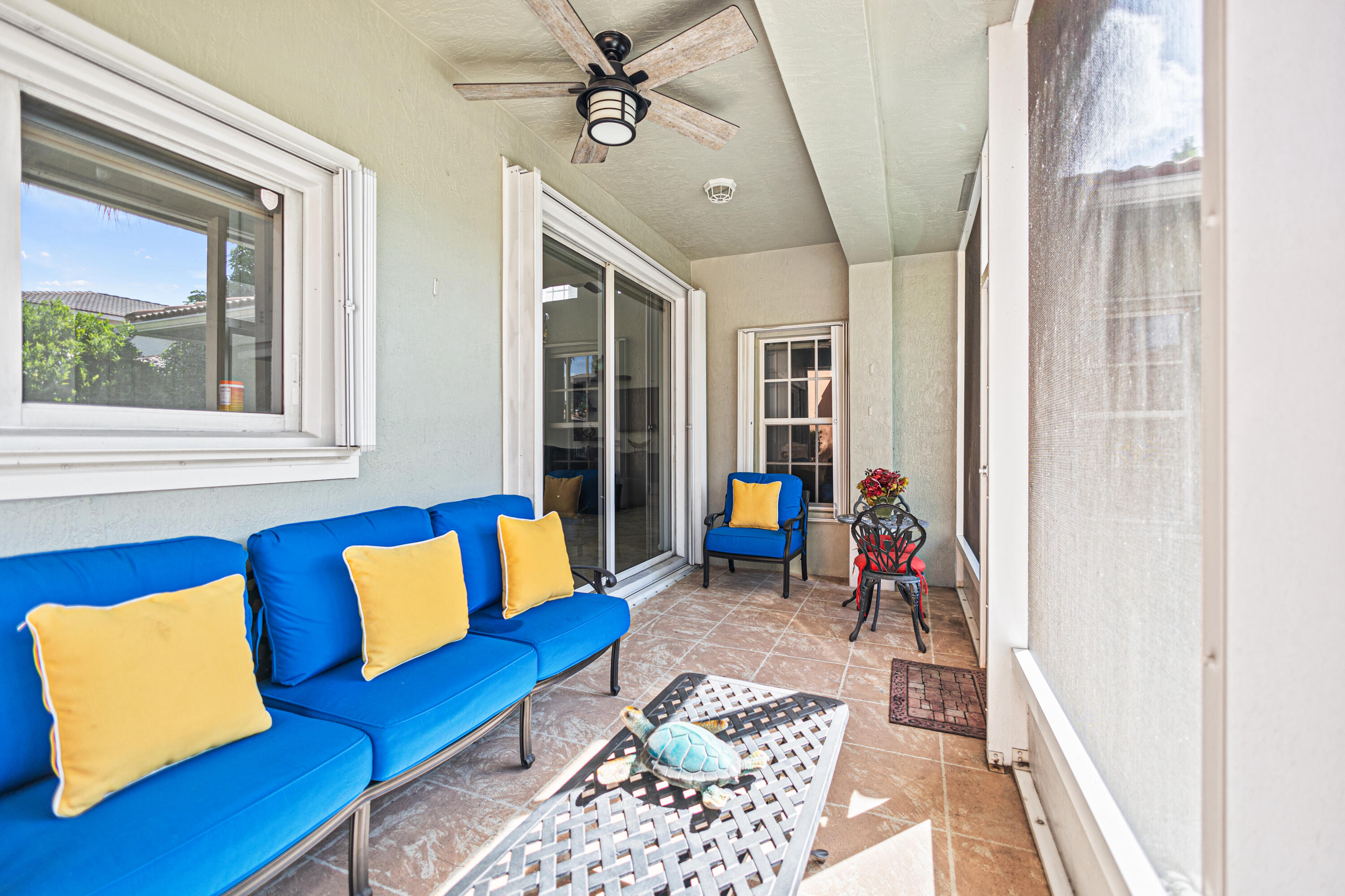 6684 Eagle Ridge Drive Greenacres, FL 33413 - Photo 18 of 27 a living room with furniture and a window