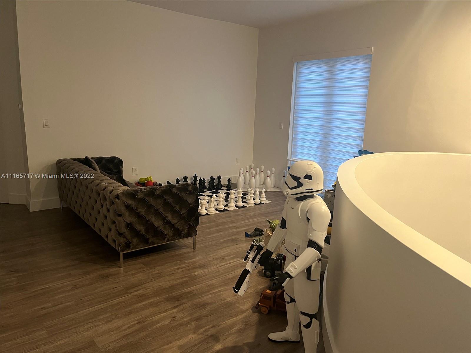 Doral Isles Doral, FL 33178 - Photo 11 of 37 a living room with furniture and a window