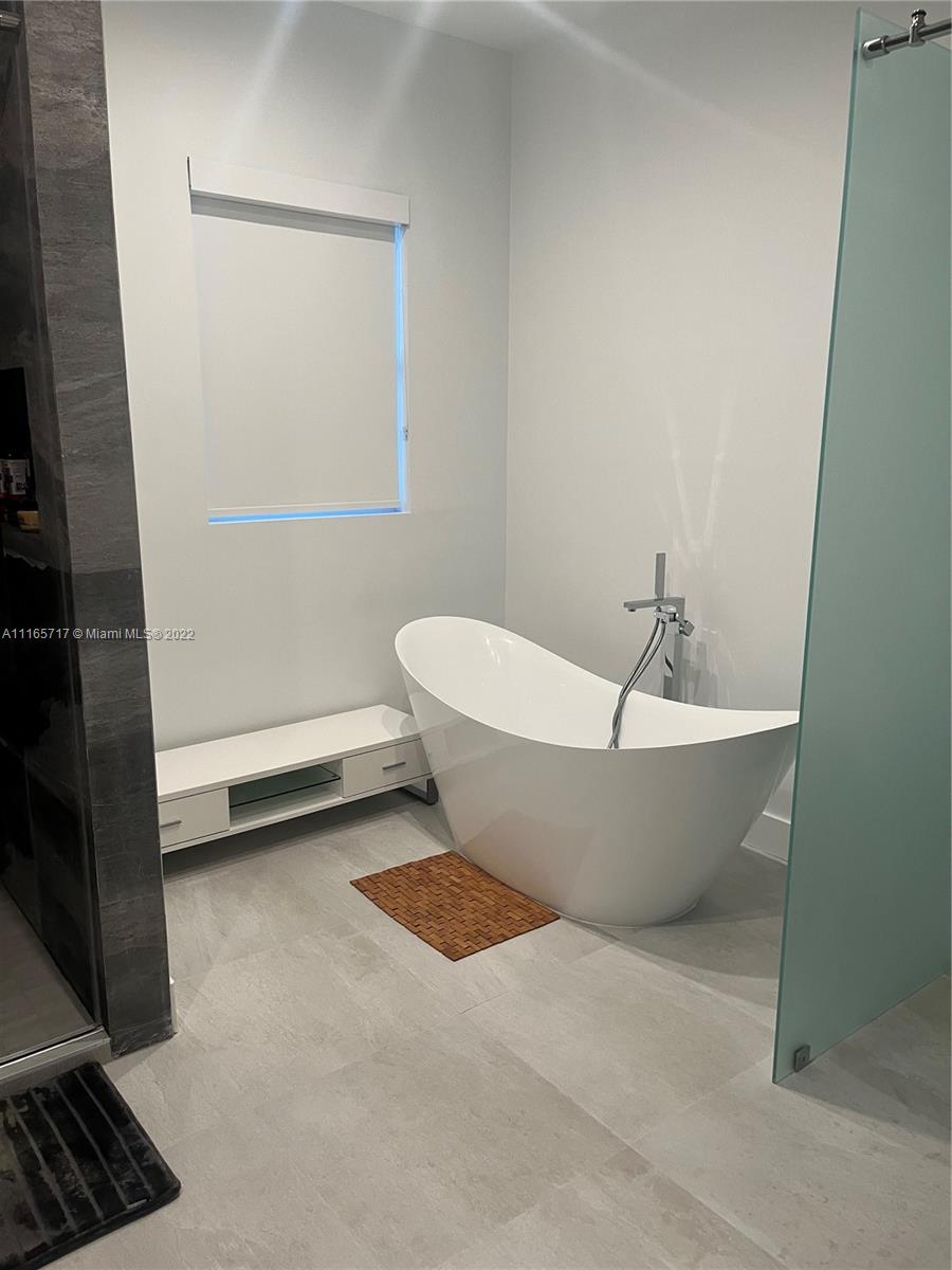 Doral Isles Doral, FL 33178 - Photo 17 of 37 a view of a bathtub in bathroom and a sink