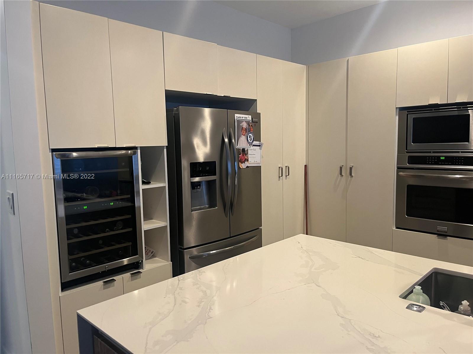 Doral Isles Doral, FL 33178 - Photo 4 of 37 a bedroom with a bed and a television