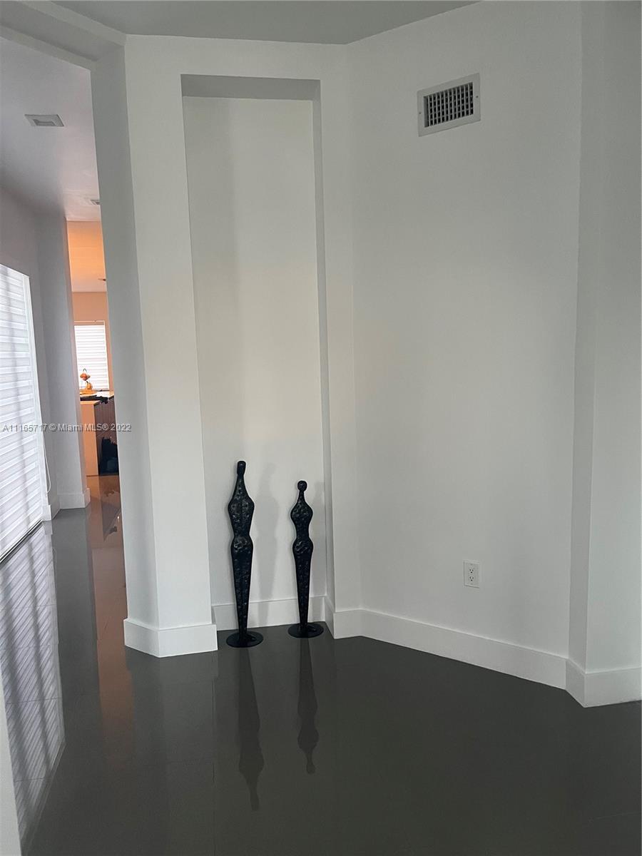 Doral Isles Doral, FL 33178 - Photo 8 of 37 a view of a room with wooden floor and stairs