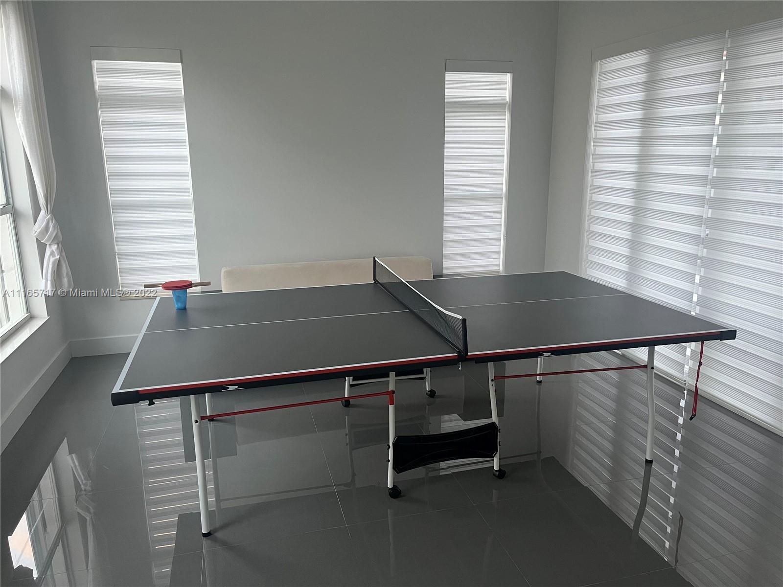 Doral Isles Doral, FL 33178 - Photo 10 of 37 a room with windows and white walls