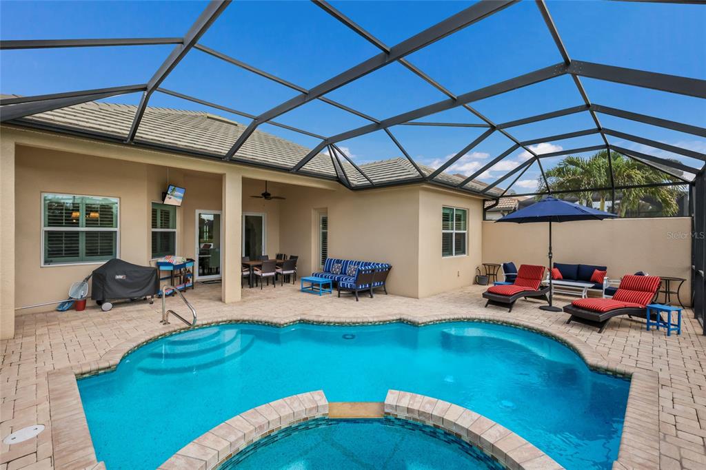 5011 Tobermory Way Bradenton, FL 34211 - Photo 27 of 77 a backyard of a house with seating space and seating space