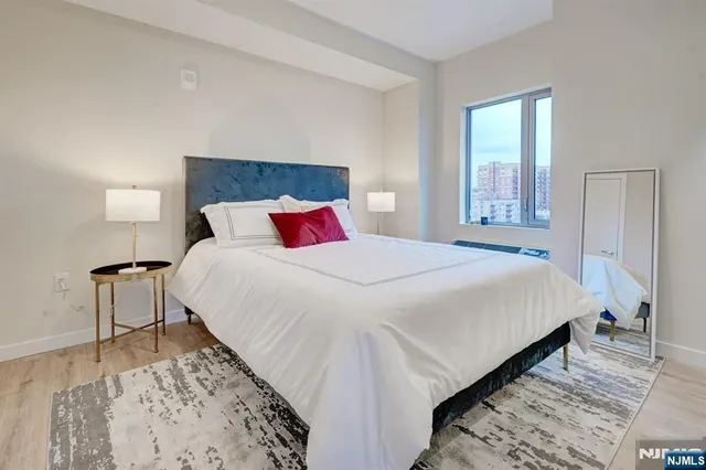 a living room with furniture large window and outer view
