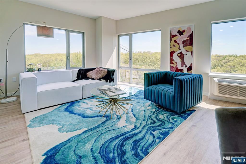 69 Main Street, Unit 1115 Fort Lee, NJ 07024 - Photo 13 of 13 a living room with furniture large window and outer view