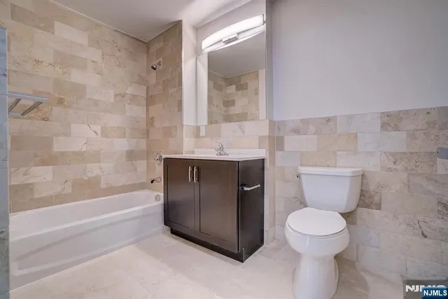 a view of an empty room with a bathroom