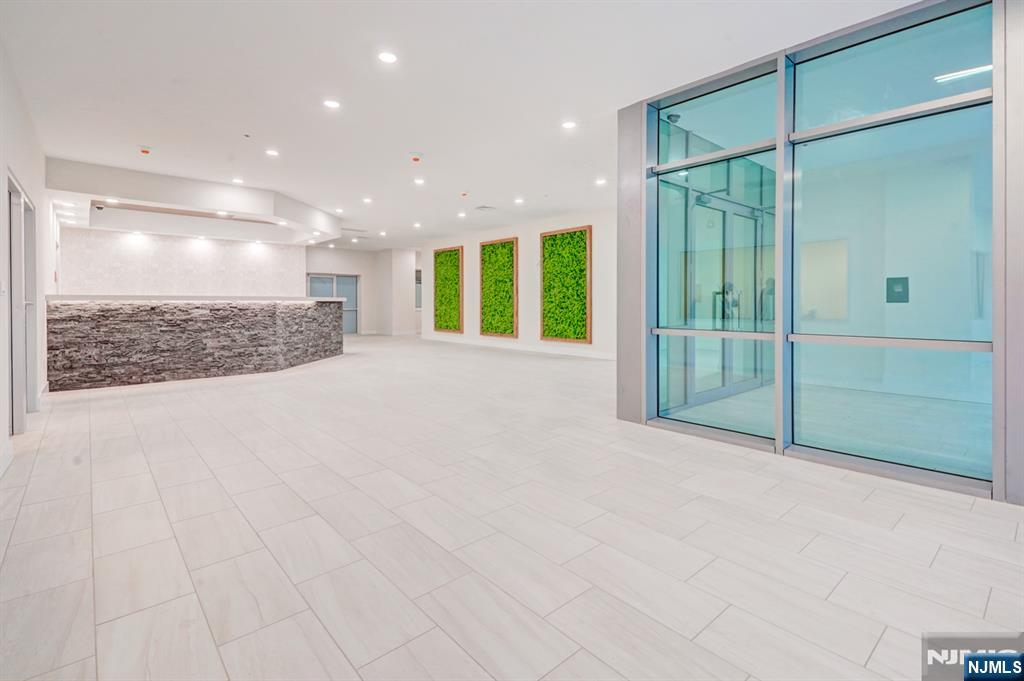 69 Main Street, Unit 1115 Fort Lee, NJ 07024 - Photo 7 of 13 a view of an empty room with a bathroom