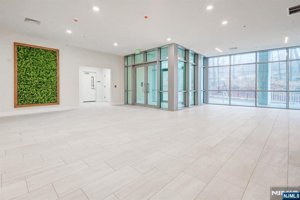 69 Main Street, Unit 1115 Fort Lee, NJ 07024 - Photo 8 of 13 a view of an empty room with a window