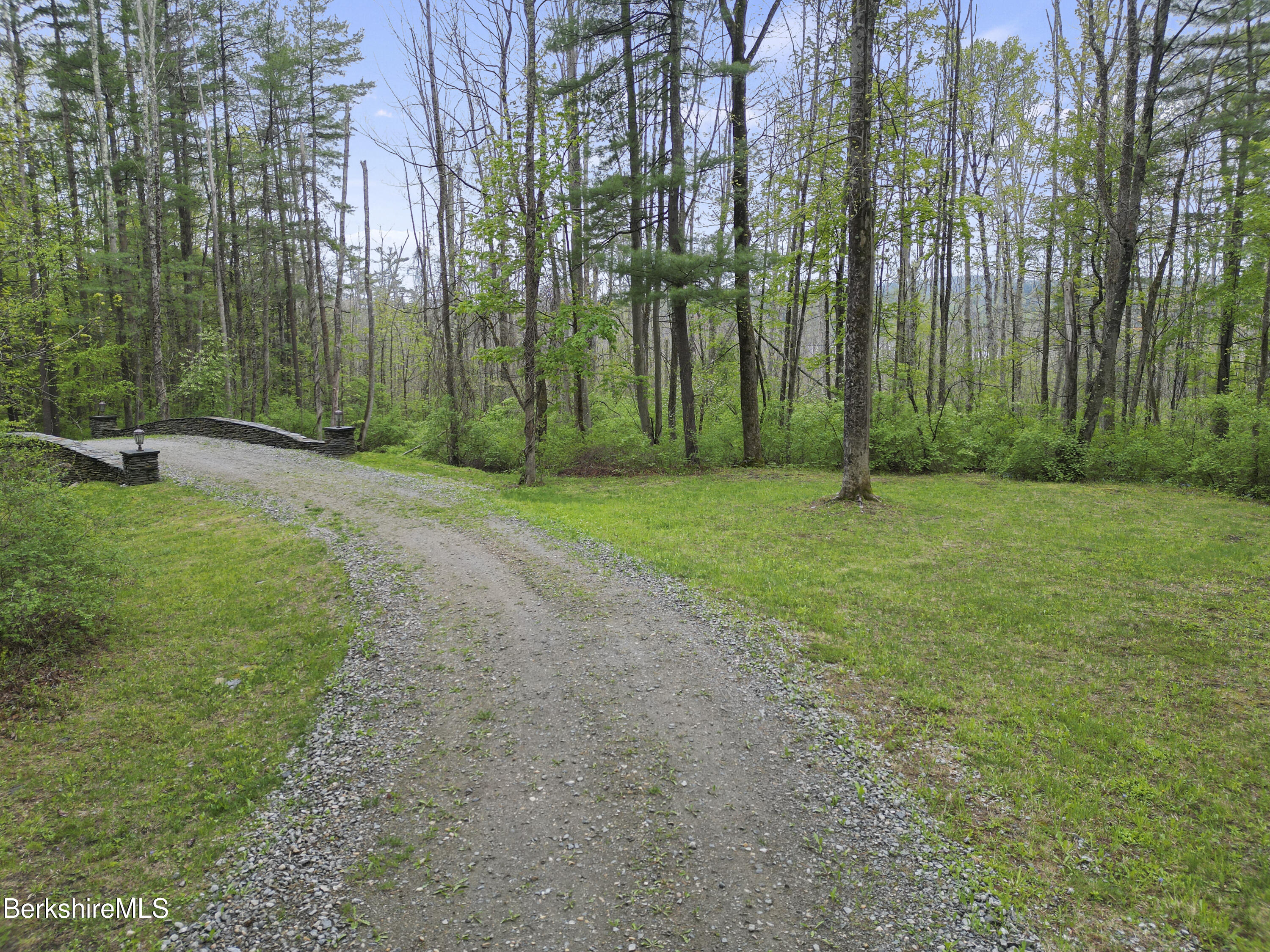 286 Lee Road Lenox, MA 01240 - Photo 12 of 26 a view of a field with a large trees