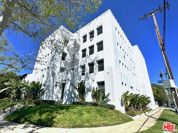 a view of building with yard