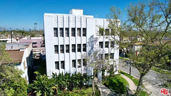 a view of a building with a garden
