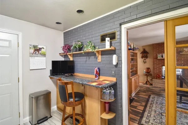 a bathroom with a sink and glass door