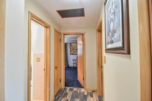 a bathroom with a granite countertop shower and a toilet