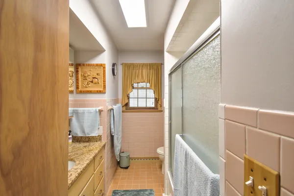 a view of walk in closet with clothes