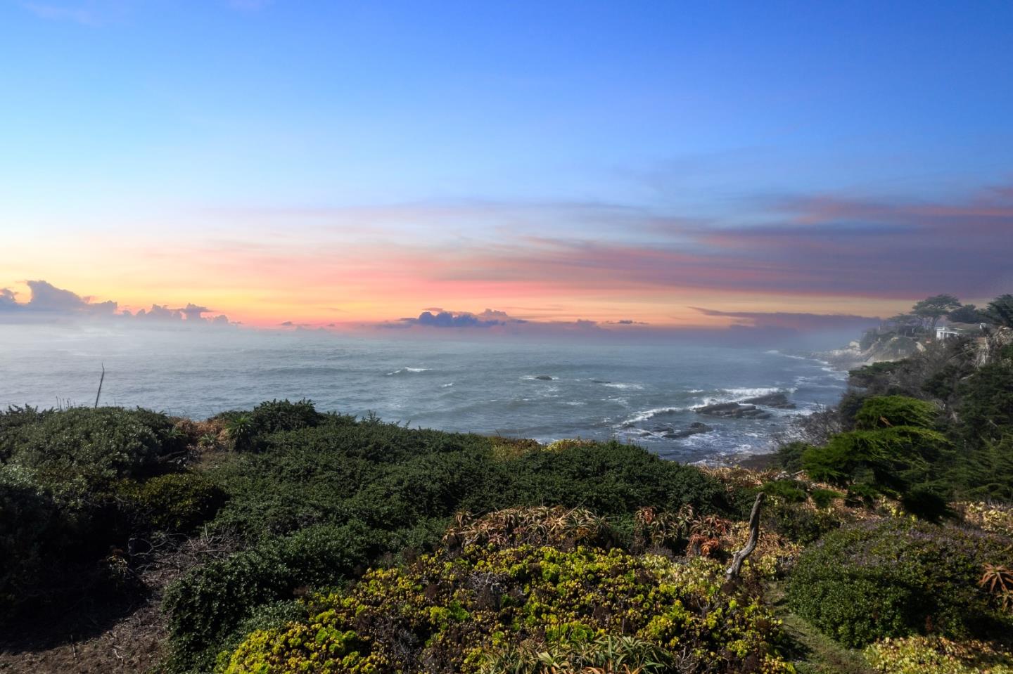355 Nevada Avenue Moss Beach, CA 94038 - Photo 1 of 1 a view of a lake with mountains in the background