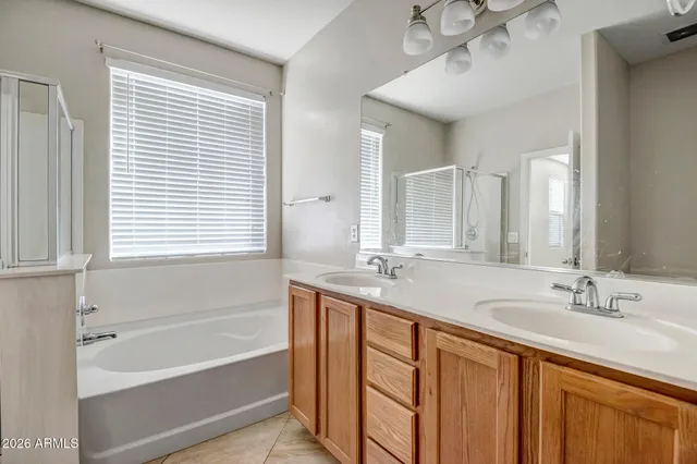 a bathroom with a shower and a tub