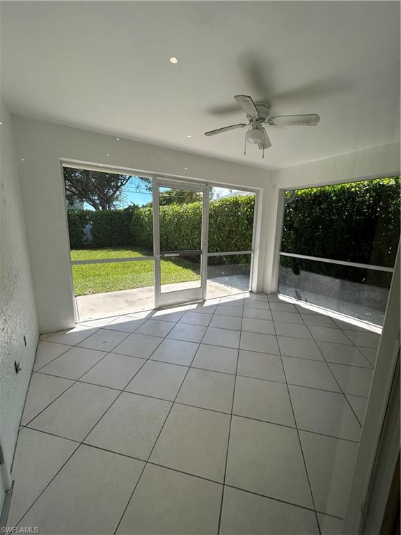 772 100th Avenue North Naples, FL 34108 - Photo 11 of 25 a view of empty room with wooden floor and fan