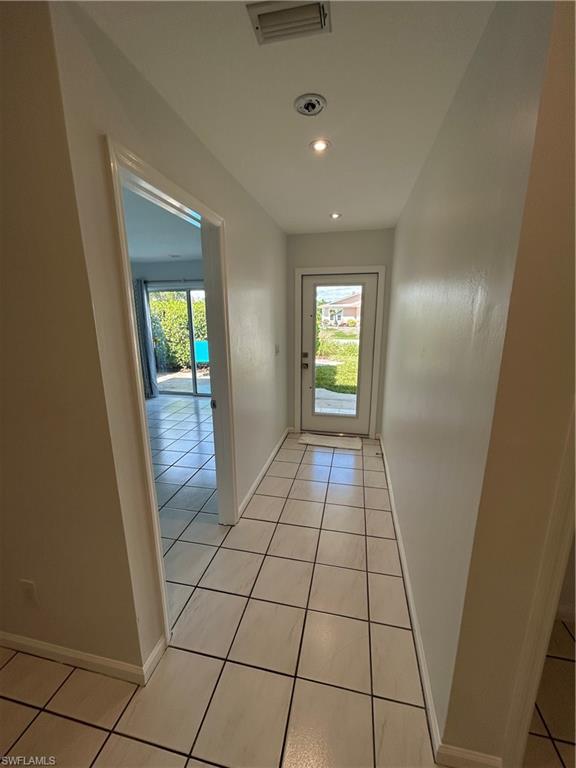 772 100th Avenue North Naples, FL 34108 - Photo 14 of 25 a view of empty room with window and hardwood floor