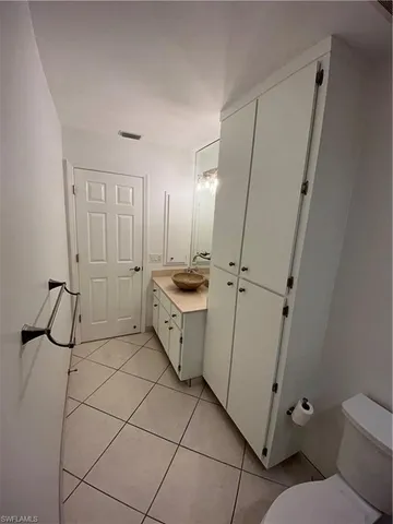 a kitchen with stainless steel appliances a refrigerator and a stove top oven