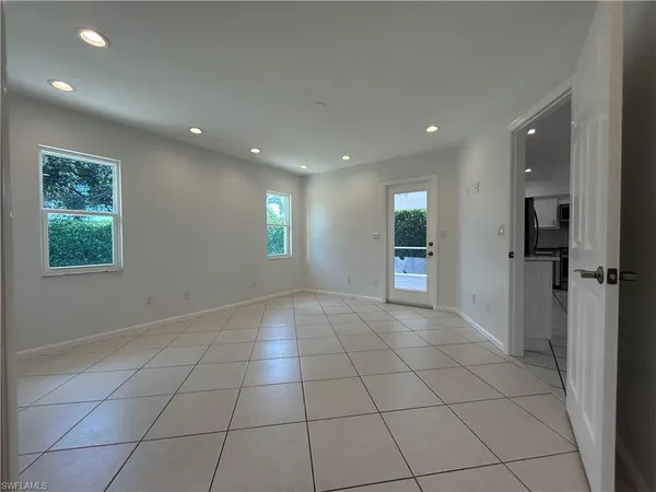 a view of a floor to ceiling window next to yard