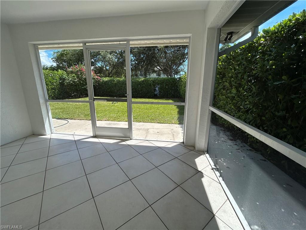 772 100th Avenue North Naples, FL 34108 - Photo 9 of 25 a view of an empty room and window