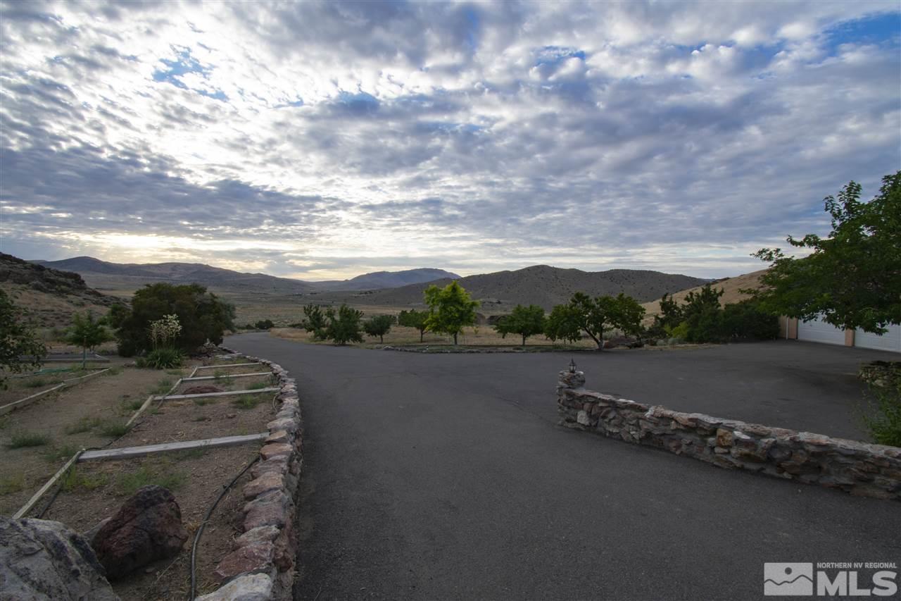 15300 Pyramid Way Reno, NV 89510 - Photo 6 of 25 a view of a city street from a yard
