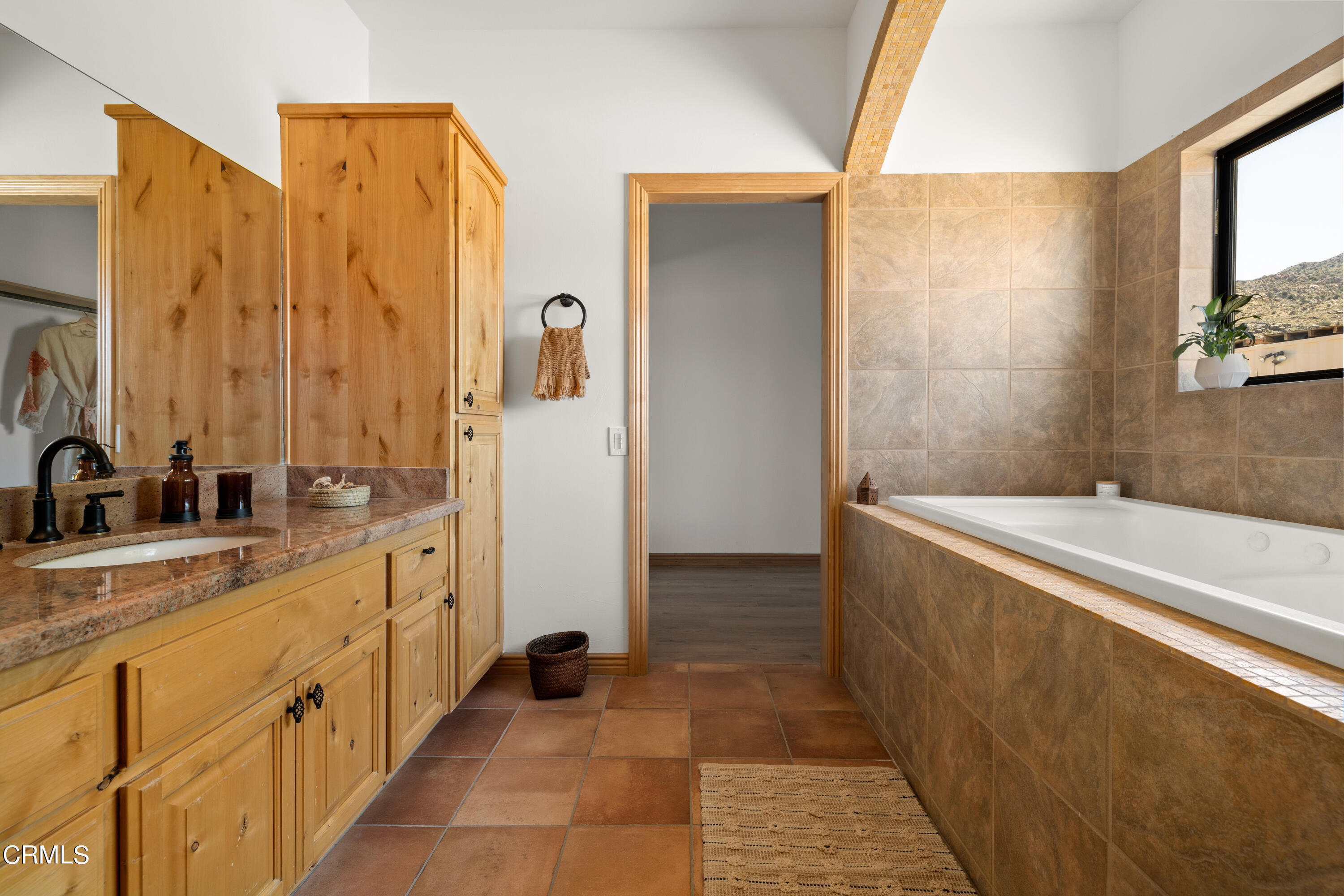 8331 Sunset Road Joshua Tree, CA 92252 - Photo 17 of 58 a bathroom with a tub sink and mirror