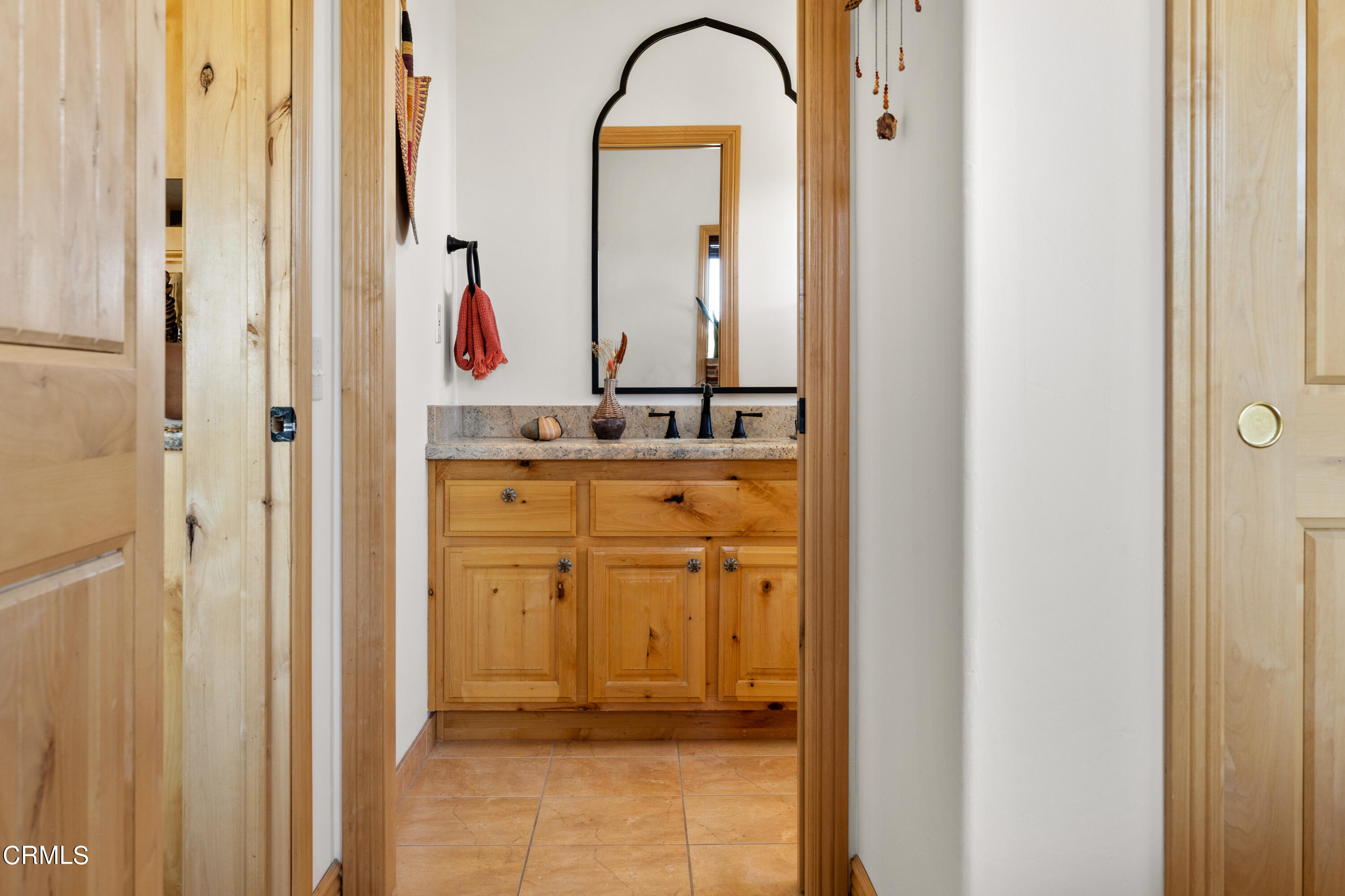 8331 Sunset Road Joshua Tree, CA 92252 - Photo 22 of 58 a bathroom with a granite countertop sink and a mirror