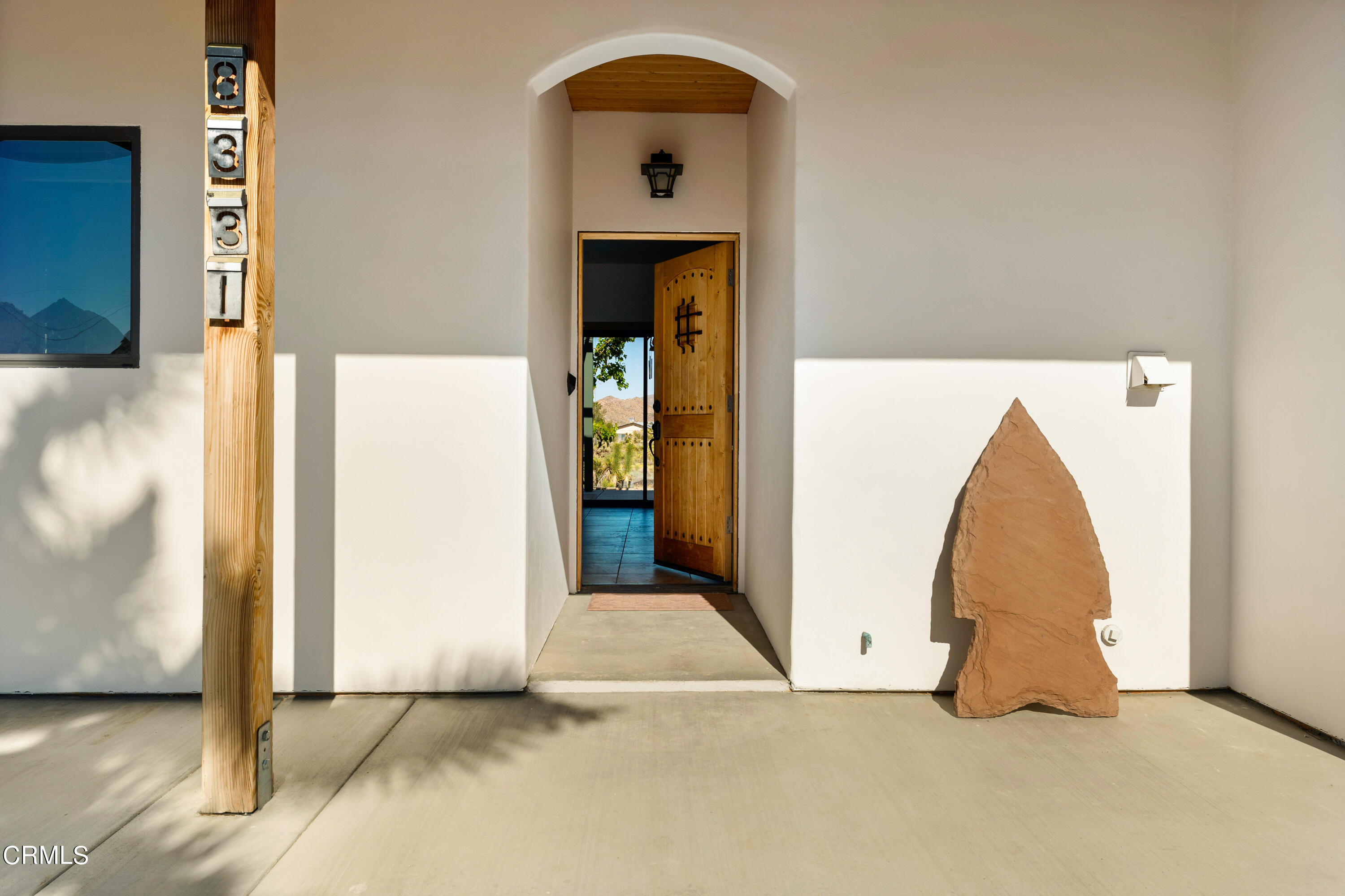 8331 Sunset Road Joshua Tree, CA 92252 - Photo 3 of 58 a view of a room with wooden floor and a hallway