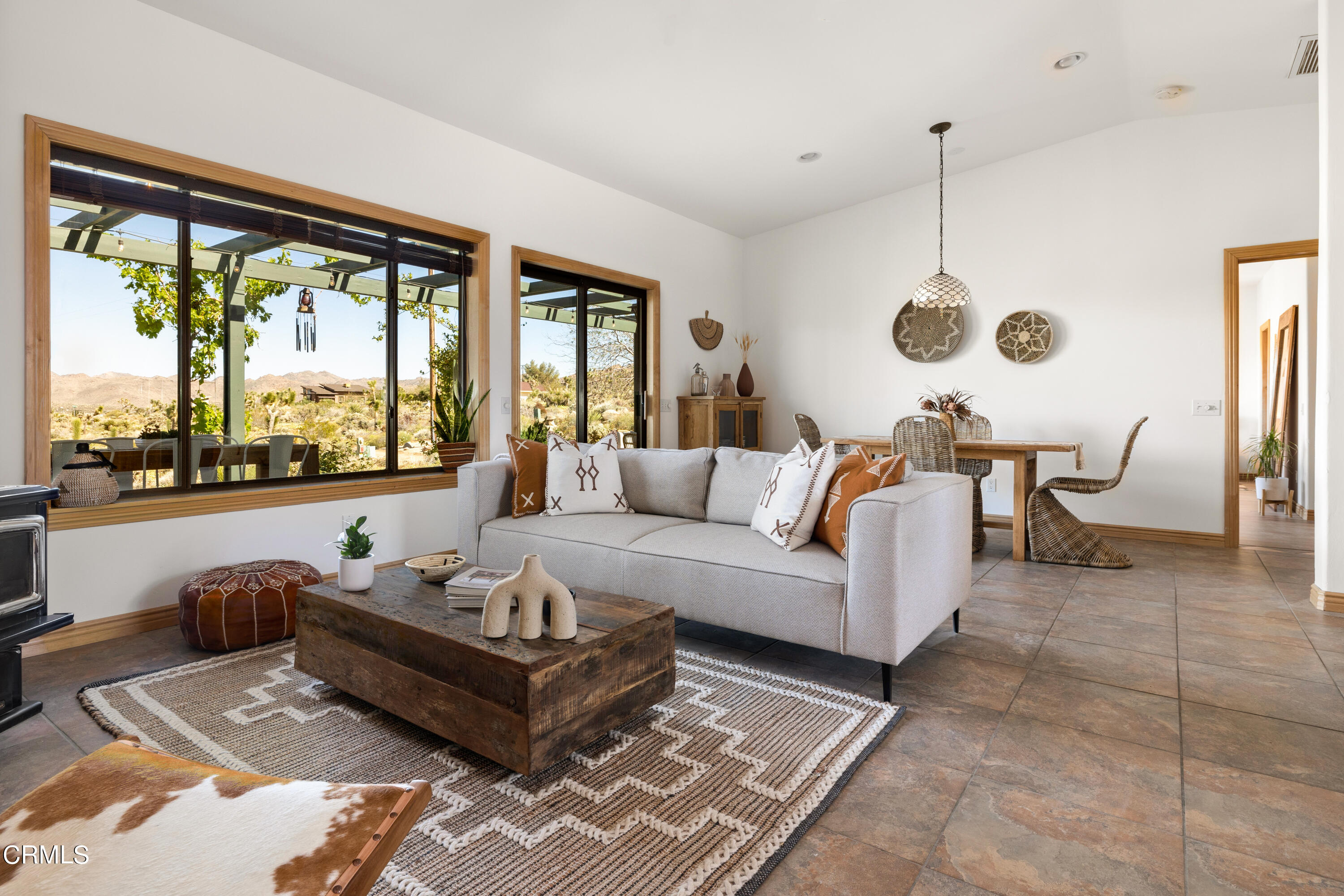 8331 Sunset Road Joshua Tree, CA 92252 - Photo 5 of 58 a living room with furniture and a large window