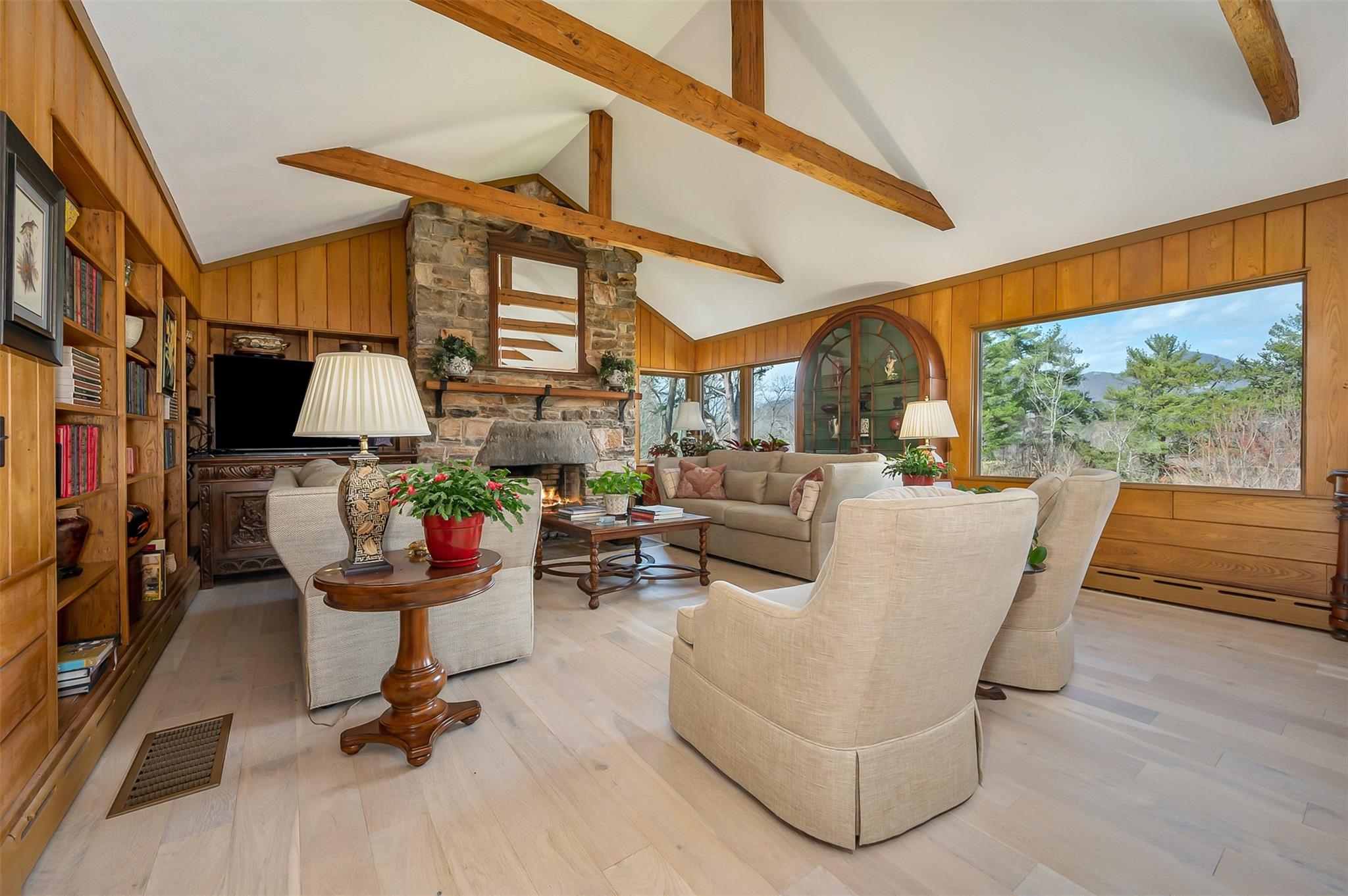 3063 Lynn Road Tryon, NC 28782 - Photo 12 of 43 a living room with furniture a fireplace and a large window