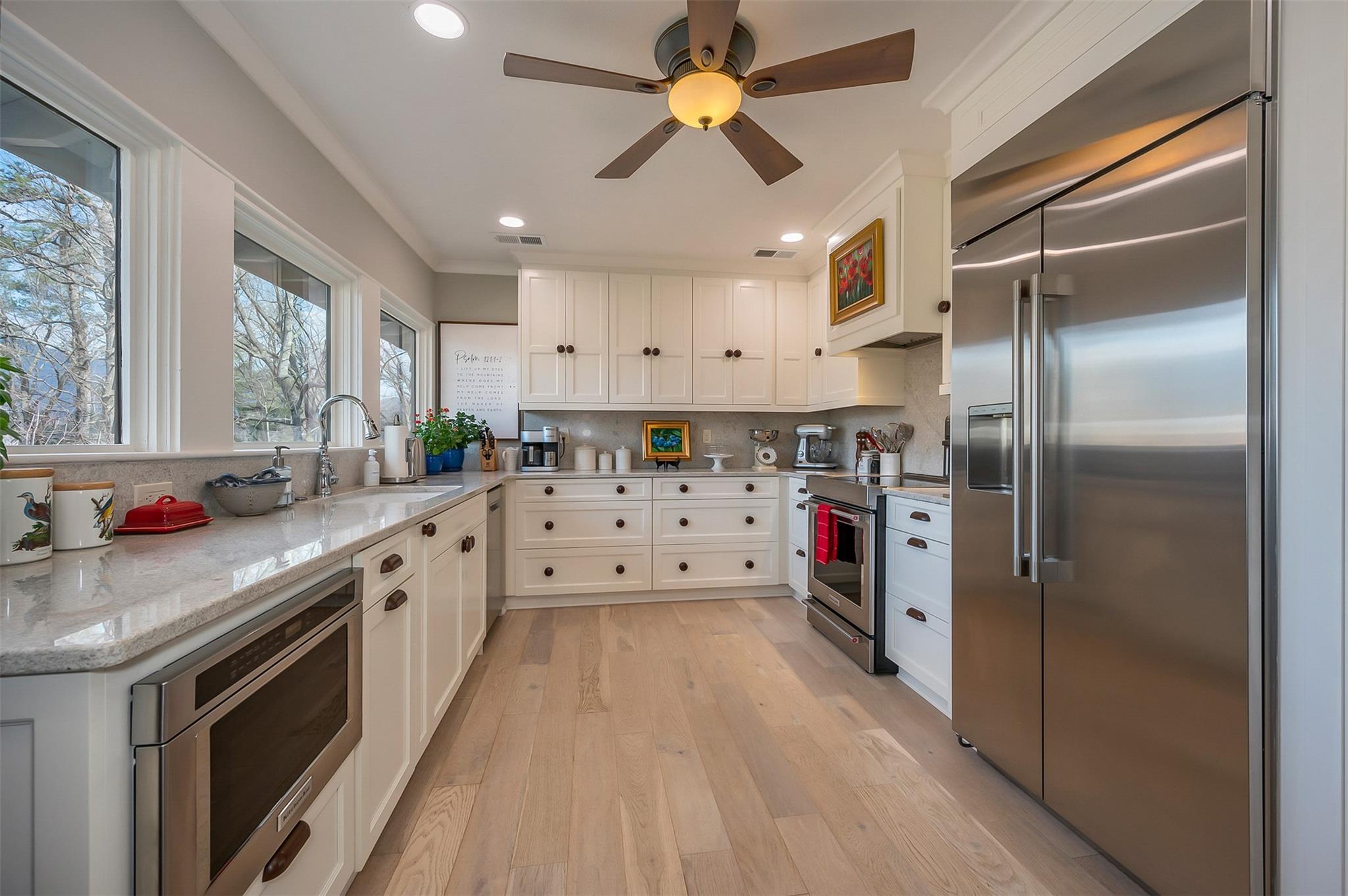 3063 Lynn Road Tryon, NC 28782 - Photo 17 of 43 a kitchen with stainless steel appliances a sink stove and refrigerator