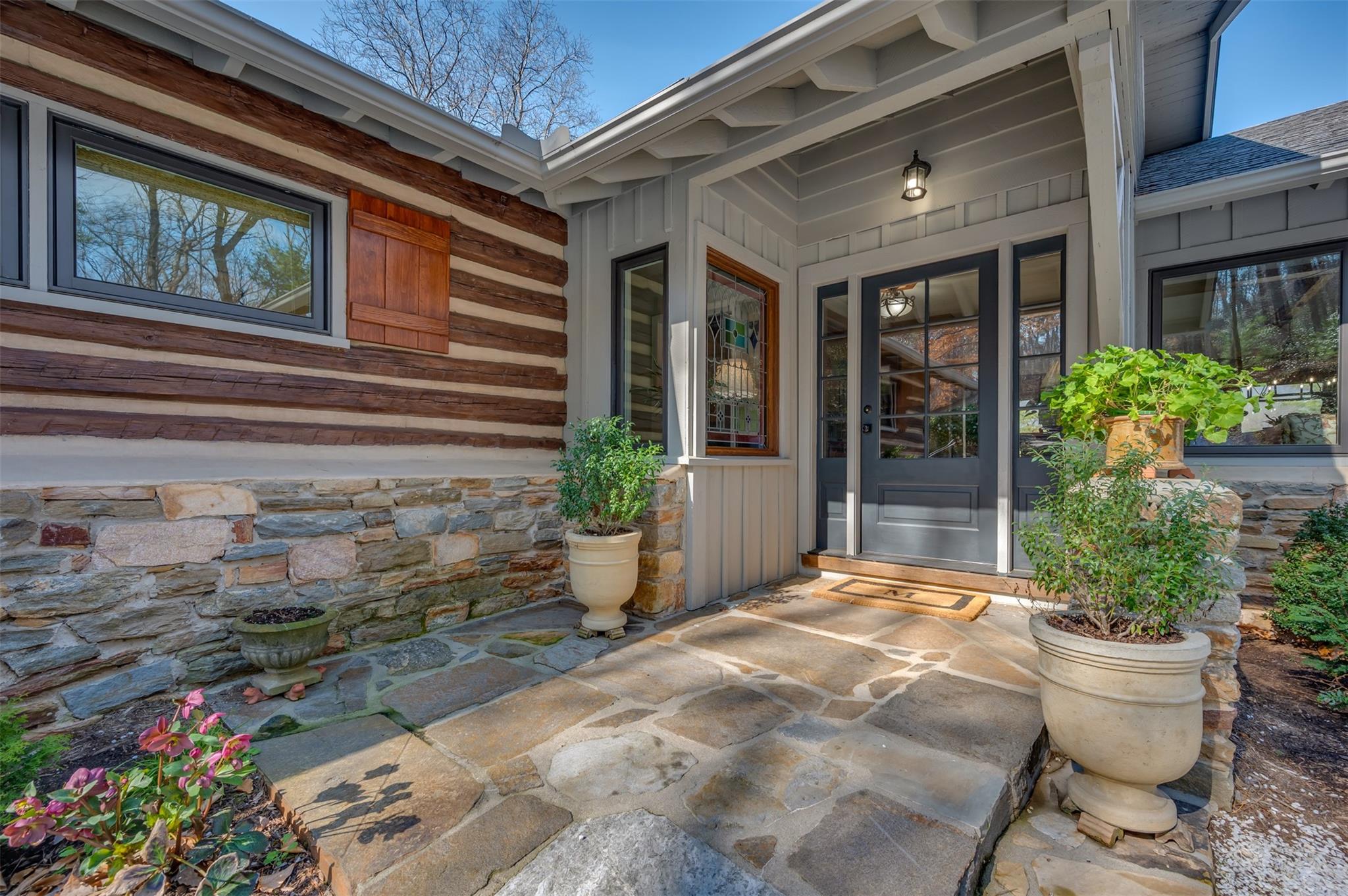 3063 Lynn Road Tryon, NC 28782 - Photo 3 of 43 a view of a house with potted plants