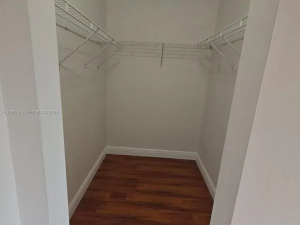 a kitchen with a sink a stove a refrigerator and cabinets