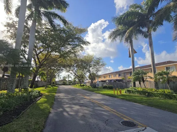 a view of street with parked cars