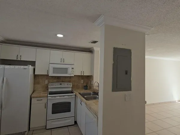 a bathroom with a sink toilet and a mirror