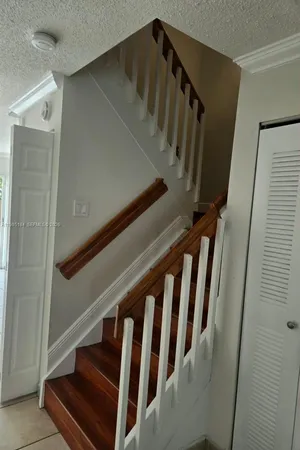 a view of an empty room with stairs