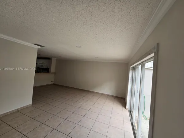 a view of an entryway with wooden floor and windows