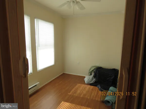 a view of bedroom with a bed and a chandelier